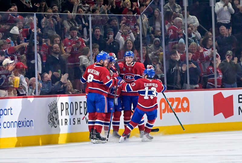 Oct 18, 2025; Montreal, Quebec, CAN; Montreal Canadiens forward Juraj Slafkovsky (20) celebrates with teammates after scoring a goal against the New York Rangers during the first period at the Bell Centre. Mandatory Credit: Eric Bolte-Imagn Images