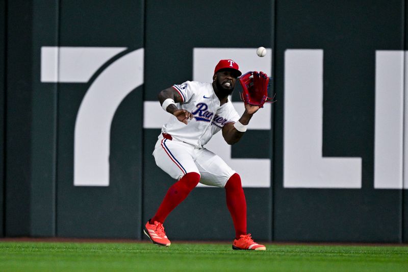 Aug 5, 2024; Arlington, Texas, USA; Texas Rangers right fielder Adolis Garcia (53) catches a fly ball hit by Houston Astros third baseman Alex Bregman (not pictured) during the sixth inning at Globe Life Field. Mandatory Credit: Jerome Miron-USA TODAY Sports