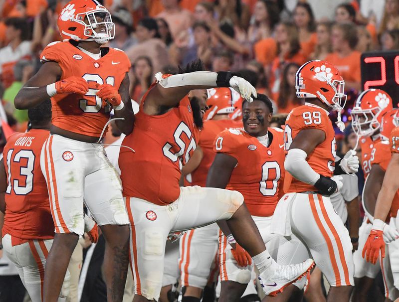 Sep 16, 2023; Clemson, South Carolina; Clemson defensive end Zaire Patterson (91) celebrates a fumble recovery with teammate defensive tackle Payton Page (55) during the fourth quarter with Florida Atlantic at Memorial Stadium.  Mandatory Credit: Ken Ruinard-USA TODAY NETWORK