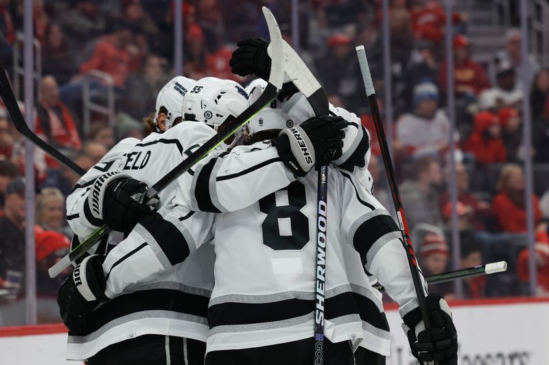 Jan 13, 2024; Detroit, Michigan, USA;  Los Angeles Kings right wing Quinton Byfield (55) receives congratulations from teammates after he scores in the first period at Little Caesars Arena. Mandatory Credit: Rick Osentoski-USA TODAY Sports