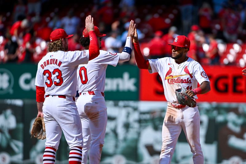 Aug 22, 2024; St. Louis, Missouri, USA;  St. Louis Cardinals center fielder Victor Scott II (11) celebrates with shortstop Masyn Winn (0) and second baseman Brendan Donovan (33) after the Cardinals defeated the Milwaukee Brewers at Busch Stadium. Mandatory Credit: Jeff Curry-USA TODAY Sports