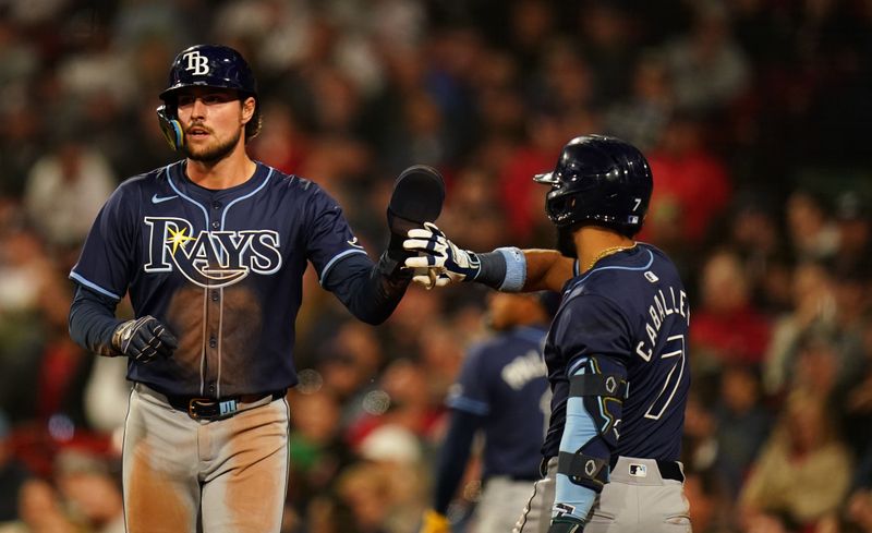 May 13, 2024; Boston, Massachusetts, USA; Tampa Bay Rays right fielder Josh Lowe (15) is congratulated after scoring against the Boston Red Sox in the eighth inning at Fenway Park. Mandatory Credit: David Butler II-USA TODAY Sports