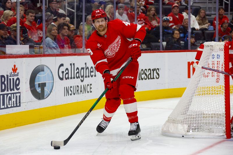 Oct 27, 2024; Detroit, Michigan, USA; Detroit Red Wings defenseman Jeff Petry (46) handles the puck during the first period of the game against the Edmonton Oilers at Little Caesars Arena. Mandatory Credit: Brian Bradshaw Sevald-Imagn Images