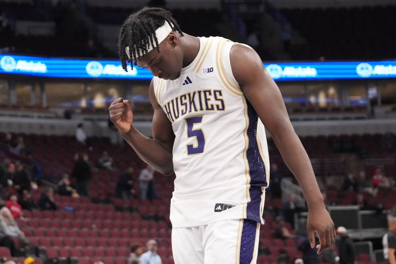 Mar 11, 2026; Chicago, IL, USA; Washington Huskies guard Zoom Diallo (5) celebrates his team’s win against the Southern California Trojans at United Center. Mandatory Credit: David Banks-Imagn Images