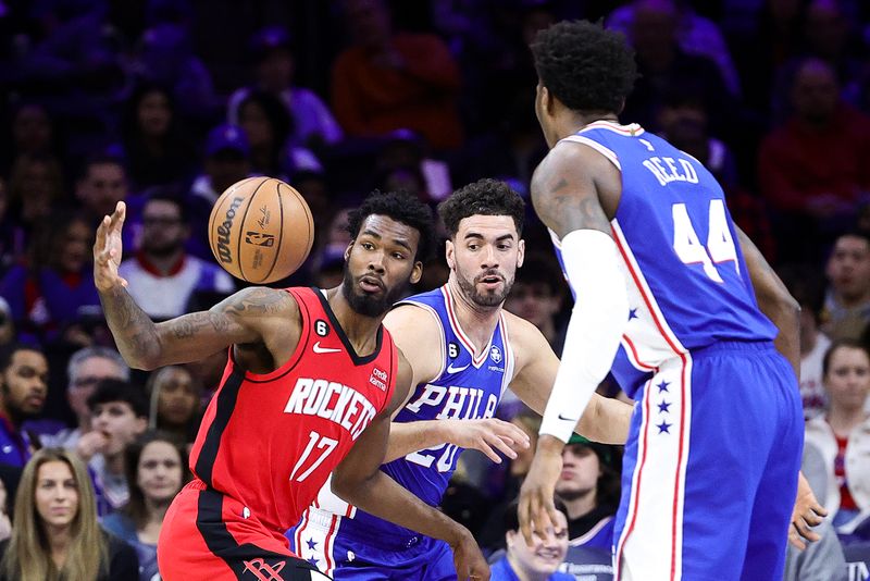 PHILADELPHIA, PENNSYLVANIA - FEBRUARY 13: Tari Eason #17 of the Houston Rockets and Georges Niang #20 of the Philadelphia 76ers challenge for the ball during the second quarter at Wells Fargo Center on February 13, 2023 in Philadelphia, Pennsylvania. NOTE TO USER: User expressly acknowledges and agrees that, by downloading and or using this photograph, User is consenting to the terms and conditions of the Getty Images License Agreement. (Photo by Tim Nwachukwu/Getty Images)