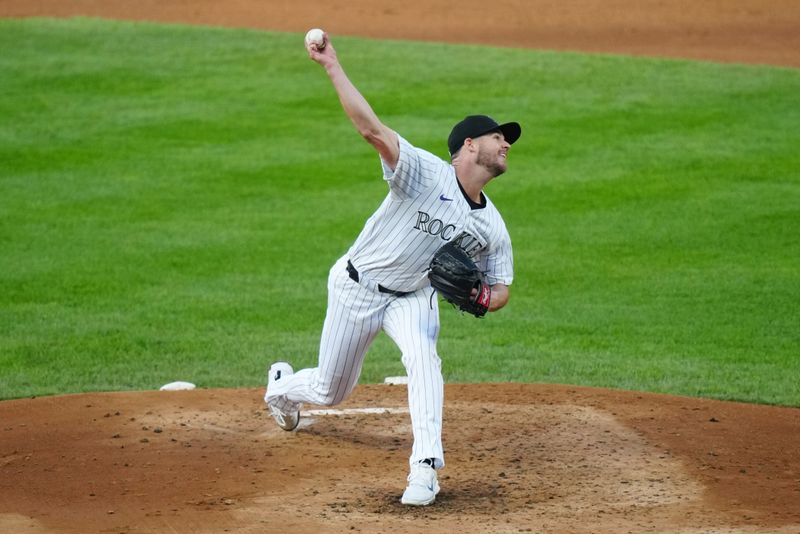 Apr 21, 2024; Denver, Colorado, USA; Colorado Rockies pitcher Peter Lambert (20) delivers a pitch in the third inning against the Seattle Mariners at Coors Field. Mandatory Credit: Ron Chenoy-USA TODAY Sports