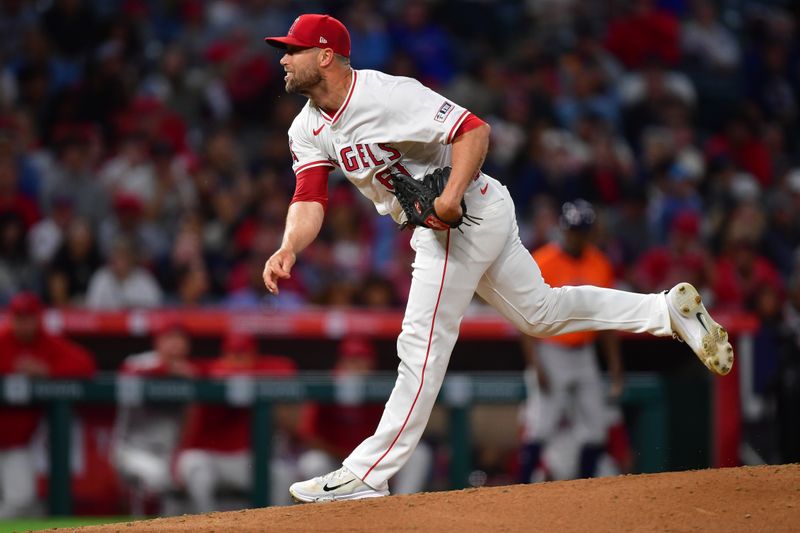 Jun 7, 2024; Anaheim, California, USA; Los Angeles Angels pitcher Hunter Strickland (61) throws against the Houston Astros during the seventh inning at Angel Stadium. Mandatory Credit: Gary A. Vasquez-USA TODAY Sports