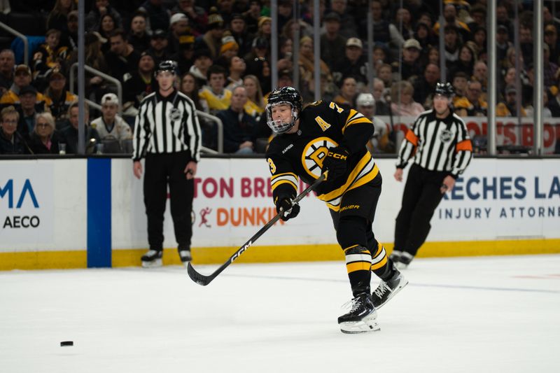 Jan 11, 2026; Boston, Massachusetts, USA; Boston Bruins defenseman Charlie McAvoy (73) shoots the puck during the first period of the game against the Pittsburgh Penguins at TD Garden. Mandatory Credit: Natalie Reid-Imagn Images