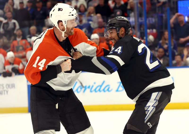 Mar 9, 2024; Tampa, Florida, USA;Philadelphia Flyers center Sean Couturier (14) and Tampa Bay Lightning defenseman Matt Dumba (24) fight during the second period at Amalie Arena. Mandatory Credit: Kim Klement Neitzel-USA TODAY Sports