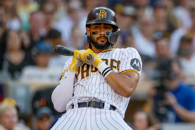Jul 29, 2023; San Diego, California, USA; San Diego Padres right fielder Fernando Tatis Jr. (23) reacts after almost being hit by a pitch during the second inning against the Texas Rangers at Petco Park. Mandatory Credit: David Frerker-USA TODAY Sports