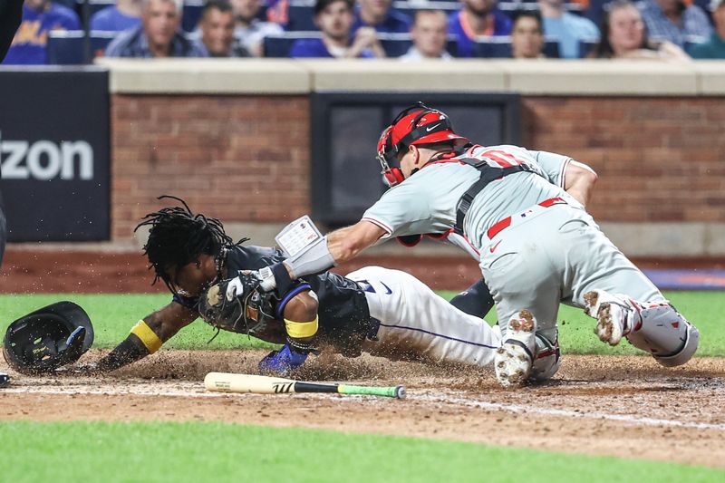 Sep 19, 2024; New York City, New York, USA;  New York Mets shortstop Luisangel Acuña (2) is tagged out at home plate by Philadelphia Phillies catcher J.T. Realmuto (10) in the seventh inning at Citi Field. Mandatory Credit: Wendell Cruz-Imagn Images