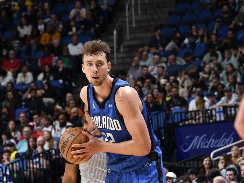 ORLANDO, FL - FEBRUARY 29: Franz Wagner #22 of the Orlando Magic handles the ball during the game against the Utah Jazz on February 29, 2024 at Amway Center in Orlando, Florida. NOTE TO USER: User expressly acknowledges and agrees that, by downloading and or using this photograph, User is consenting to the terms and conditions of the Getty Images License Agreement. Mandatory Copyright Notice: Copyright 2024 NBAE (Photo by Fernando Medina/NBAE via Getty Images)