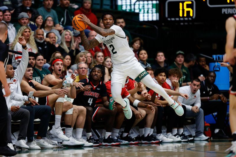 Dec 6, 2023; Fort Collins, Colorado, USA; Colorado State Rams guard Taviontae Jackson (2) attempts to keep the ball in bounds in the first half against the Denver Pioneers at Moby Arena. Mandatory Credit: Isaiah J. Downing-USA TODAY Sports