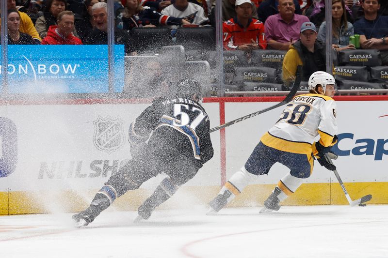 Nov 6, 2024; Washington, District of Columbia, USA; Nashville Predators left wing Zachary L'Heureux (68) skates with the puck as Washington Capitals defenseman Trevor van Riemsdyk (57) chases in the second period at Capital One Arena. Mandatory Credit: Geoff Burke-Imagn Images