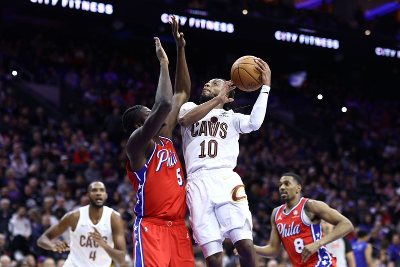 PHILADELPHIA, PENNSYLVANIA - FEBRUARY 23: Darius Garland #10 of the Cleveland Cavaliers shoots a lay up over Mo Bamba #5 of the Philadelphia 76ers during the third quarter at the Wells Fargo Center on February 23, 2024 in Philadelphia, Pennsylvania. (Photo by Tim Nwachukwu/Getty Images)