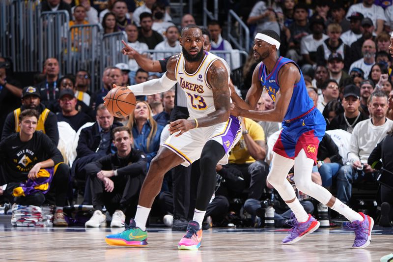 DENVER, CO - APRIL 20: LeBron James #23 of the Los Angeles Lakers handles the ball during the game against the Denver Nuggets during Round 1 Game 1 of the 2024 NBA Playoffs on April 20, 2024 at the Ball Arena in Denver, Colorado. NOTE TO USER: User expressly acknowledges and agrees that, by downloading and/or using this Photograph, user is consenting to the terms and conditions of the Getty Images License Agreement. Mandatory Copyright Notice: Copyright 2024 NBAE (Photo by Garrett Ellwood/NBAE via Getty Images)