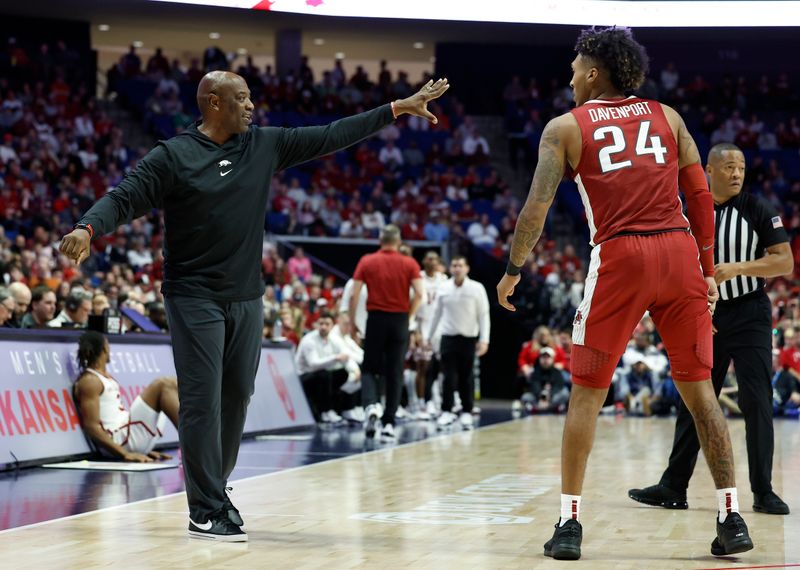 Dec 9, 2023; Tulsa, Oklahoma, USA; Arkansas Razorbacks assistant coach Keith Smart talks to guard Jeremiah Davenport (24) during the second half at BOK Center. Mandatory Credit: Alonzo Adams-USA TODAY Sports