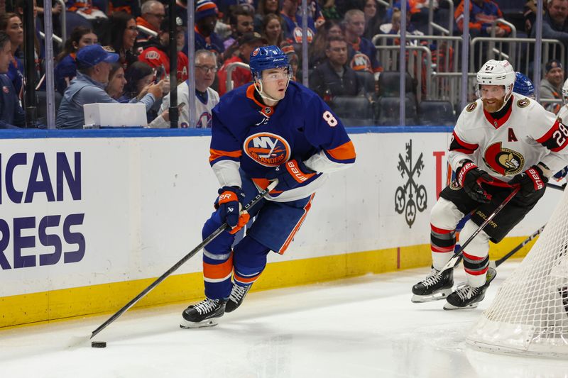 Mar 16, 2024; Elmont, New York, USA;  New York Islanders defenseman Noah Dobson (8) skates with the puck during the first period against Ottawa Senators at UBS Arena. Mandatory Credit: Thomas Salus-USA TODAY Sports