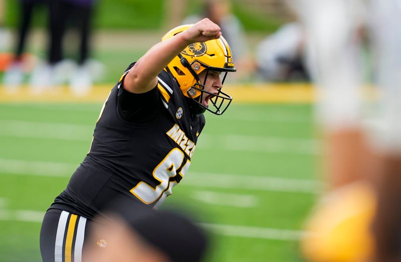 Sep 16, 2023; Columbia, Missouri, USA; Missouri Tigers place kicker Harrison Mevis (92) celebrates after kicking the game winning field goal as time expires in the second half against the Kansas State Wildcats at Faurot Field at Memorial Stadium. Mandatory Credit: Jay Biggerstaff-USA TODAY Sports