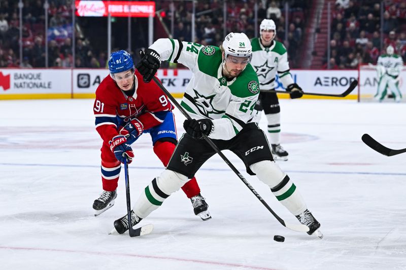 Nov 13, 2025; Montreal, Quebec, CAN; Dallas Stars center Roope Hintz (24) plays the puck against Montreal Canadiens center Oliver Kapanen (91) during the third period at Bell Centre. Mandatory Credit: David Kirouac-Imagn Images