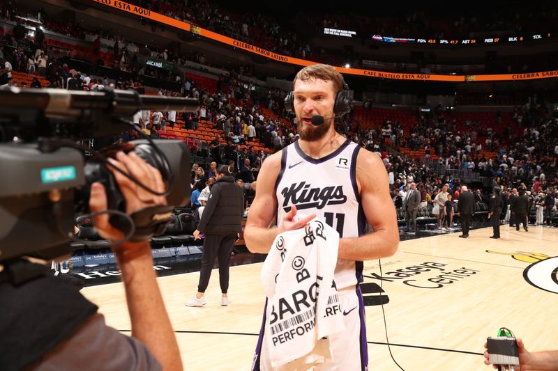 MIAMI, FL - NOVEMBER 4: Domantas Sabonis #11 of the Sacramento Kings talks to the media after the game against the Miami Heat during a regular season game on November 4, 2024 at Kaseya Center in Miami, Florida. NOTE TO USER: User expressly acknowledges and agrees that, by downloading and or using this Photograph, user is consenting to the terms and conditions of the Getty Images License Agreement. Mandatory Copyright Notice: Copyright 2024 NBAE (Photo by Issac Baldizon/NBAE via Getty Images)