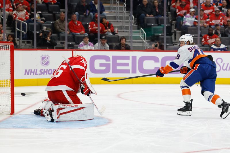 Nov 20, 2025; Detroit, Michigan, USA;  New York Islanders right wing Max Shabanov (49) shoots and scores on Detroit Red Wings goaltender John Gibson (36) in the third period at Little Caesars Arena. Mandatory Credit: Rick Osentoski-Imagn Images