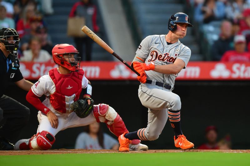 Sep 15, 2023; Anaheim, California, USA; Detroit Tigers right fielder Kerry Carpenter (30) hits a single against the Los Angeles Angels during the first inning at Angel Stadium. Mandatory Credit: Gary A. Vasquez-USA TODAY Sports