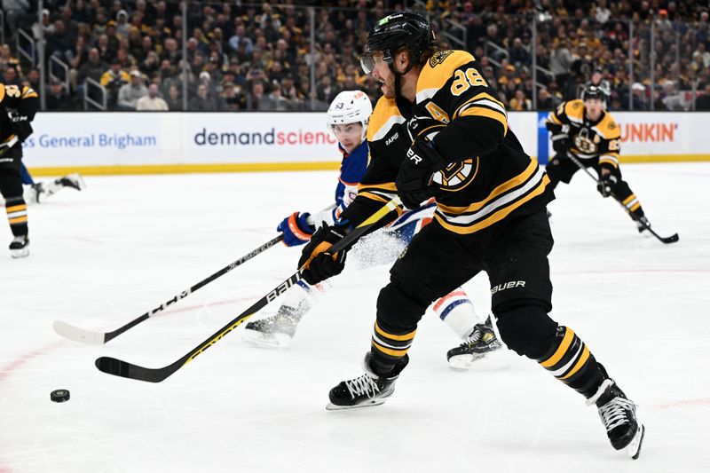 Mar 9, 2023; Boston, Massachusetts, USA; Boston Bruins right wing David Pastrnak (88) attempts a shot in front of Edmonton Oilers center Ryan Nugent-Hopkins (93) during the first period at the TD Garden. Mandatory Credit: Brian Fluharty-USA TODAY Sports