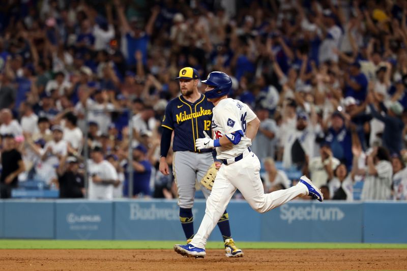 Jul 5, 2024; Los Angeles, California, USA;  Los Angeles Dodgers catcher Will Smith (16) runs around bases after hitting third home run of the game during the seventh inning against the Milwaukee Brewers at Dodger Stadium. Mandatory Credit: Kiyoshi Mio-USA TODAY Sports