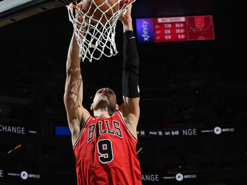 SAN FRANCISCO, CA - MARCH 7: Nikola Vucevic #9 of the Chicago Bulls dunks the ball during the game against the Golden State Warriors on March 7, 2024 at Chase Center in San Francisco, California. NOTE TO USER: User expressly acknowledges and agrees that, by downloading and or using this photograph, user is consenting to the terms and conditions of Getty Images License Agreement. Mandatory Copyright Notice: Copyright 2024 NBAE (Photo by Noah Graham/NBAE via Getty Images)