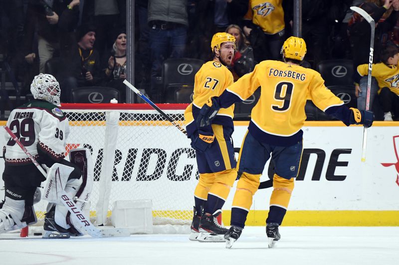 Feb 10, 2024; Nashville, Tennessee, USA; Nashville Predators defenseman Ryan McDonagh (27) celebrates with left wing Filip Forsberg (9) after scoring the game-winning goal in overtime against Arizona Coyotes goaltender Connor Ingram (39) at Bridgestone Arena. Mandatory Credit: Christopher Hanewinckel-USA TODAY Sports