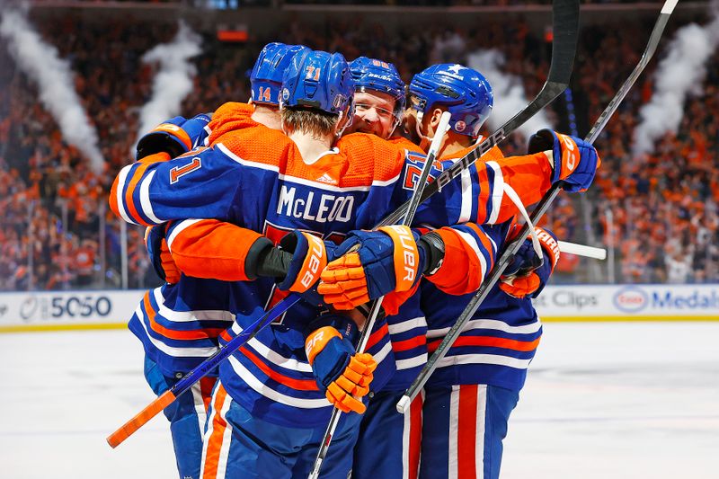 May 12, 2024; Edmonton, Alberta, CAN; The Edmonton Oilers celebrate a goal scored by defensemen Mattias Ekholm (14) during the first period against the Vancouver Canucks in game three of the second round of the 2024 Stanley Cup Playoffs at Rogers Place. Mandatory Credit: Perry Nelson-USA TODAY Sports