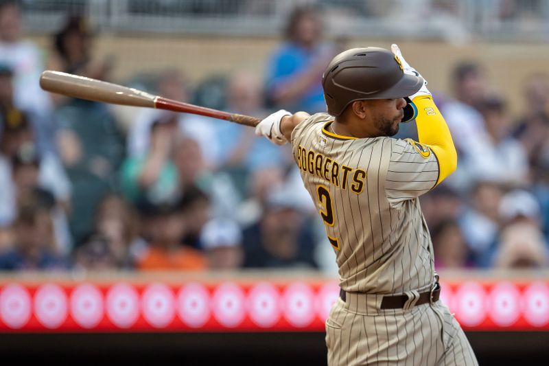 May 10, 2023; Minneapolis, Minnesota, USA; San Diego Padres shortstop Xander Bogaerts (2) hits a single in the fifth inning against the Minnesota Twins at Target Field. Mandatory Credit: Jesse Johnson-USA TODAY Sports