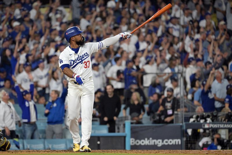 Oct 11, 2024; Los Angeles, California, USA; Los Angeles Dodgers outfielder Teoscar Hernandez (37) hits a solo home run in the seventh inning against the San Diego Padres during game five of the NLDS for the 2024 MLB Playoffs at Dodger Stadium. Mandatory Credit: Jayne Kamin-Oncea-Imagn Images