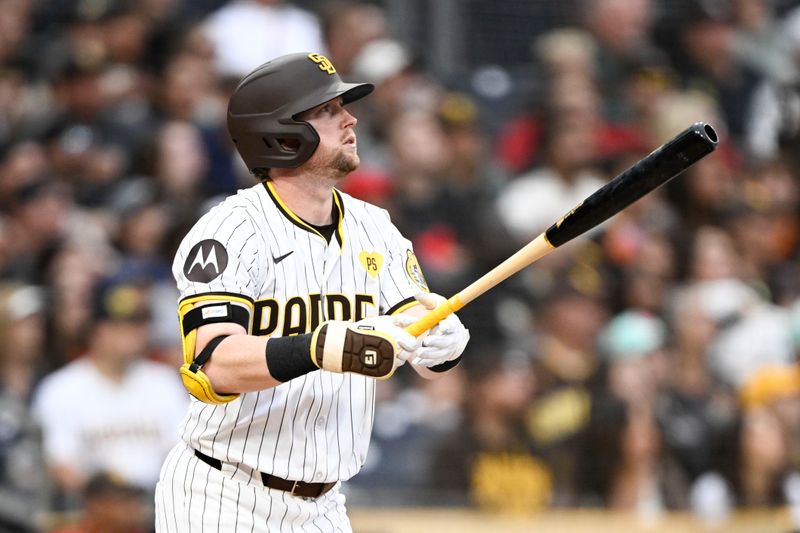 Jun 8, 2024; San Diego, California, USA; San Diego Padres first baseman Jake Cronenworth (9) hits a three-run home run during the fourth inning against the San Diego Padres at Petco Park. Mandatory Credit: Denis Poroy-USA TODAY Sports at Petco Park. 