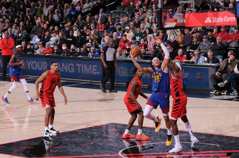 PORTLAND, OR - MARCH 23: Aaron Gordon #50 of the Denver Nuggets drives to the basket during the game against the Portland Trail Blazers on March 23, 2024 at the Moda Center Arena in Portland, Oregon. NOTE TO USER: User expressly acknowledges and agrees that, by downloading and or using this photograph, user is consenting to the terms and conditions of the Getty Images License Agreement. Mandatory Copyright Notice: Copyright 2024 NBAE (Photo by Cameron Browne/NBAE via Getty Images)