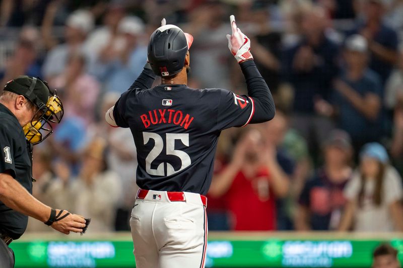 Sep 25, 2024; Minneapolis, Minnesota, USA; Minnesota Twins center fielder Byron Buxton (25) celebrates after hitting a solo home run against the Miami Marlins in the fourth inning at Target Field. Mandatory Credit: Jesse Johnson-Imagn Images