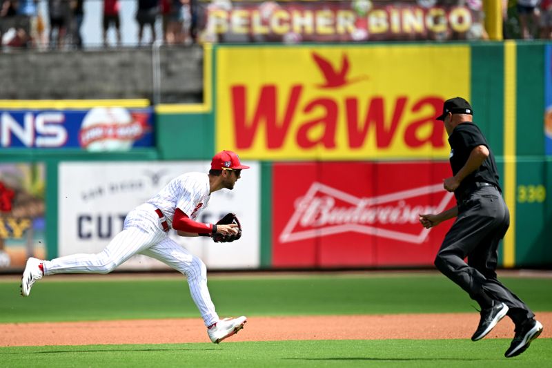 Mar 8, 2024; Clearwater, Florida, USA; Philadelphia Phillies shortstop Trea Turner (7) prepares to throw to first base  in the first inning of the spring training game against the Houston Astros at BayCare Ballpark. Mandatory Credit: Jonathan Dyer-USA TODAY Sports