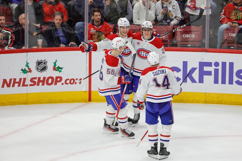 Dec 22, 2023; Chicago, Illinois, USA; Montreal Canadiens left wing Juraj Slafkovsky (20) celebrates with teammates after scoring against the Chicago Blackhawks during the second period at United Center. Mandatory Credit: Kamil Krzaczynski-USA TODAY Sports