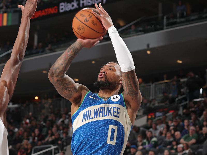 MILWAUKEE, WI - FEBRUARY 12: Damian Lillard #0 of the Milwaukee Bucks three point basket during the game against the Denver Nuggets on February 12, 2024 at the Fiserv Forum Center in Milwaukee, Wisconsin. NOTE TO USER: User expressly acknowledges and agrees that, by downloading and or using this Photograph, user is consenting to the terms and conditions of the Getty Images License Agreement. Mandatory Copyright Notice: Copyright 2024 NBAE (Photo by Gary Dineen/NBAE via Getty Images).