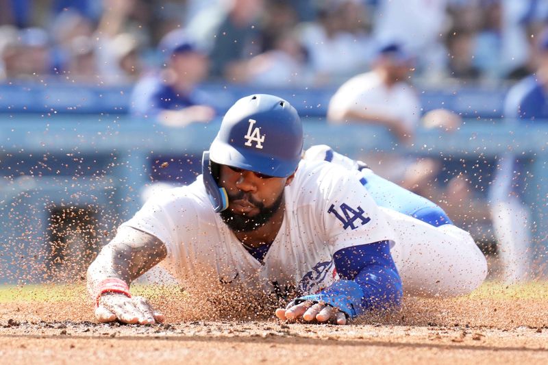 Jun 3, 2023; Los Angeles, California, USA; Los Angeles Dodgers right fielder Jason Heyward (23) slides into home plate to score in the second inning against the New York Yankees at Dodger Stadium. Mandatory Credit: Kirby Lee-USA TODAY Sports