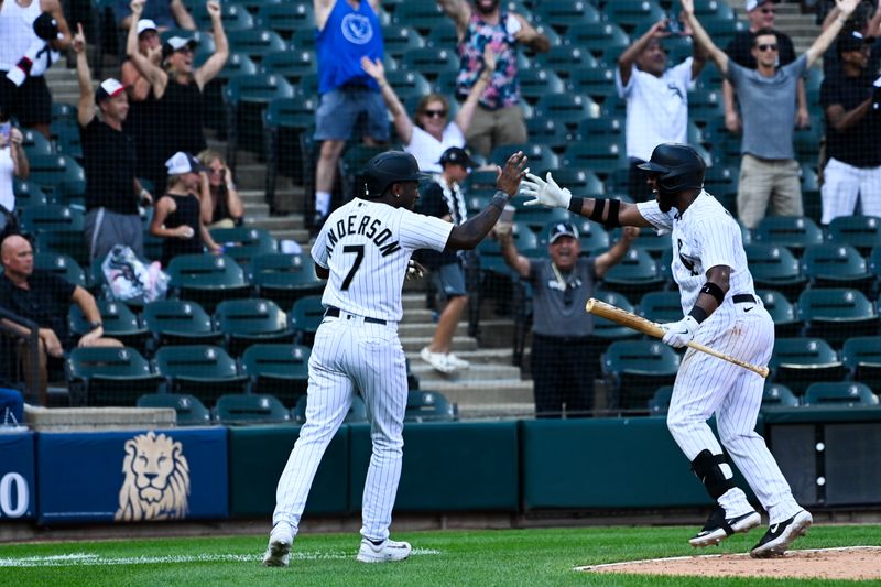 Aug 23, 2023; Chicago, Illinois, USA;  Chicago White Sox shortstop Tim Anderson (7), left, celebrates with Chicago White Sox shortstop Elvis Andrus (1) after scoring during the tenth inning to beat the Seattle Mariners at Guaranteed Rate Field. Mandatory Credit: Matt Marton-USA TODAY Sports