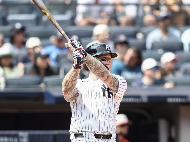 Jul 4, 2024; Bronx, New York, USA; New York Yankees left fielder Alex Verdugo (24) hits a double in the fourth inning against the Cincinnati Reds at Yankee Stadium. Mandatory Credit: Wendell Cruz-USA TODAY Sports