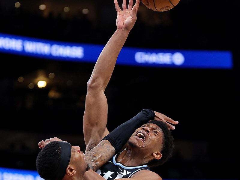 ATLANTA, GEORGIA - FEBRUARY 12:  Torrey Craig #13 of the Chicago Bulls blocks a shot by De'Andre Hunter #12 of the Atlanta Hawks during the second quarter at State Farm Arena on February 12, 2024 in Atlanta, Georgia.  NOTE TO USER: User expressly acknowledges and agrees that, by downloading and/or using this photograph, user is consenting to the terms and conditions of the Getty Images License Agreement.  (Photo by Kevin C. Cox/Getty Images)