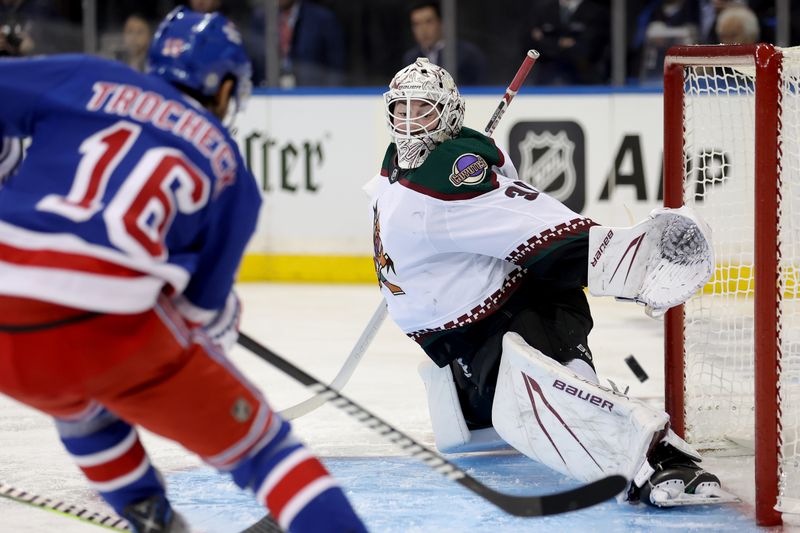 Oct 16, 2023; New York, New York, USA; Arizona Coyotes goaltender Connor Ingram (39) makes a save against New York Rangers center Vincent Trocheck (16) during the second period at Madison Square Garden. Mandatory Credit: Brad Penner-USA TODAY Sports