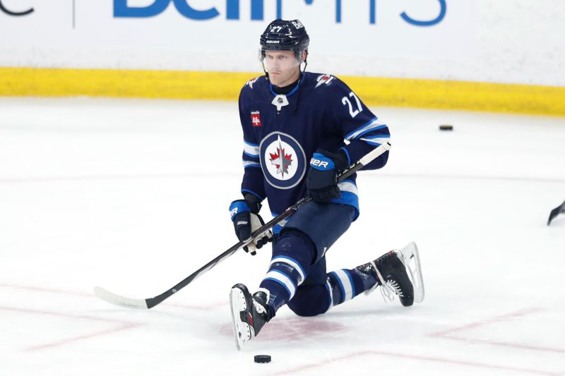 Apr 4, 2024; Winnipeg, Manitoba, CAN; Winnipeg Jets left wing Nikolaj Ehlers (27) warms up before game against the Calgary Flames at Canada Life Centre. Mandatory Credit: James Carey Lauder-USA TODAY Sports