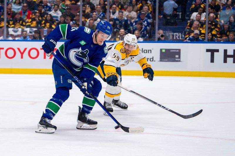 Apr 21, 2024; Vancouver, British Columbia, CAN; Nashville Predators defenseman Roman Josi (59) stick checks Vancouver Canucks forward Pius Suter (24) in the first period in game one of the first round of the 2024 Stanley Cup Playoffs at Rogers Arena. Mandatory Credit: Bob Frid-USA TODAY Sports