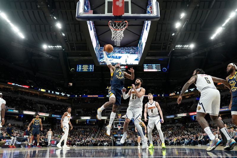 INDIANAPOLIS, IN - JANUARY 23: Buddy Heild #7 of the Indiana Pacers drives to the basket during the game against the Denver Nuggets on January 23, 2024 at Gainbridge Fieldhouse in Indianapolis, Indiana. NOTE TO USER: User expressly acknowledges and agrees that, by downloading and or using this Photograph, user is consenting to the terms and conditions of the Getty Images License Agreement. Mandatory Copyright Notice: Copyright 2024 NBAE (Photo by AJ Mast/NBAE via Getty Images)