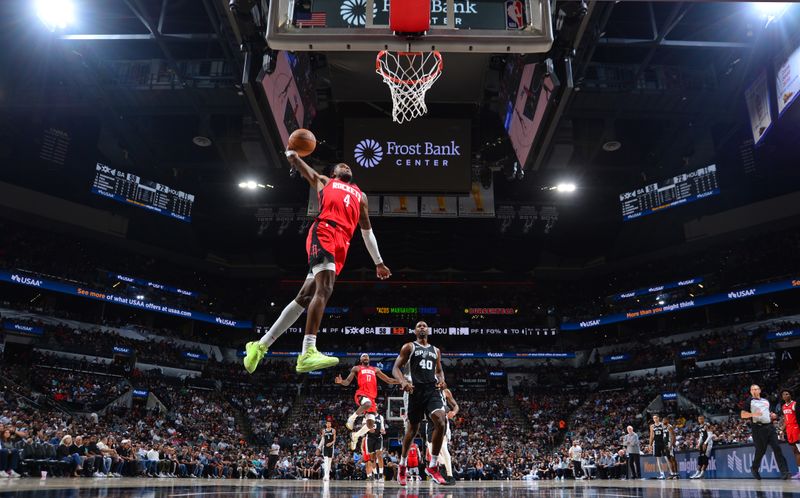 SAN ANTONIO, TX - OCTOBER 28: Jalen Green #4 of the Houston Rockets dunks the ball during the game against the San Antonio Spurs during a regular season game on October 28, 2024 at the Frost Bank Center in San Antonio, Texas. NOTE TO USER: User expressly acknowledges and agrees that, by downloading and or using this photograph, user is consenting to the terms and conditions of the Getty Images License Agreement. Mandatory Copyright Notice: Copyright 2024 NBAE (Photos by Michael Gonzales/NBAE via Getty Images)