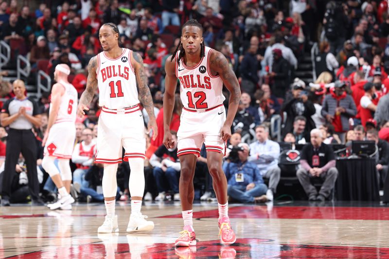 CHICAGO, IL - MARCH 27: Ayo Dosunmu #12 of the Chicago Bulls looks on during the game against the Indiana Pacers on March 27, 2024 at United Center in Chicago, Illinois. NOTE TO USER: User expressly acknowledges and agrees that, by downloading and or using this photograph, User is consenting to the terms and conditions of the Getty Images License Agreement. Mandatory Copyright Notice: Copyright 2024 NBAE (Photo by Jeff Haynes/NBAE via Getty Images)